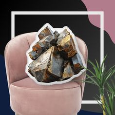 a pile of rocks sitting on top of a pink chair next to a potted plant