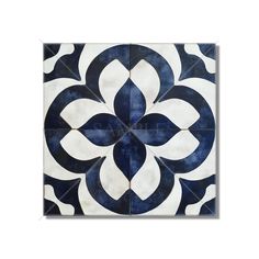 a blue and white tile with an intricate design