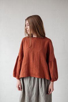 Tunic is made from 100% soft and washed linen. Match it with our skirts! Details: - Composition: 100% Oeko-Tex certified linen - Colour: rust - Ruffle neckline - Dropped shoulders - Size: One size/fits all - Medium weight linen - Linen care: machine wash gentle; tumble dry low, ironing optional - The price is for one tunic, other pictured items are not included Measurements: Length from shoulder down: 55 cm (21,66 in) Chest width: 140 cm (55,1 in) Sleeve length (from collar): 60 cm (23,6 in) Bot Rust Blouse Outfit, Linen Lagenlook Blouse For Fall, Oversized Bohemian Linen Tops, Fall Linen Tunic Blouse, Flax Relaxed Fit Top For Fall, Oversized Long Sleeve Ramie Tops, Fall Lagenlook Linen Tops, Simple Top Pattern, Linen Shirt Outfit