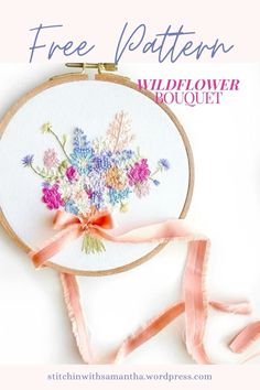 an embroidery project with flowers and ribbon on the hoop, which reads free pattern wildflower bouquet