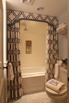 an image of a bathroom with shower curtain and bathtub in the background, taken on instagram