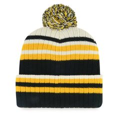 a black, yellow and white striped beanie with a pom - pom