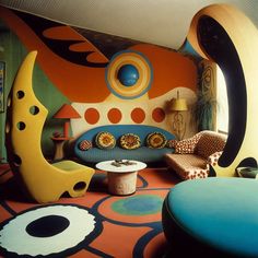 a living room filled with lots of colorful furniture and decor on top of carpeted flooring