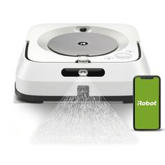 a robot vacuum is connected to a phone with the appliance on it's side