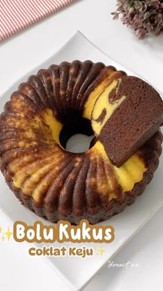 a bundt cake on a plate with a piece cut out