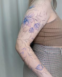 a woman with a tattoo on her arm