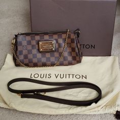 Discontinued Louis Vuitton Lv Eva Clutch Crossbody Damier Ebene. Good Condition. Purchased Pre Loved. Normal Wear On Brass Plate And Hardware. Some Stains Inside As Pictured. Zipper Works In Great Condition. Ships With Dust Bag, Long Strap And Box. Purchase With Confidence Because Posh Will Authenticate It. 10"L X 2"W X 5"H Date Code Aa4105 Louis Vuitton Eva, Brass Plate, Damier Ebene, Louis Vuitton Damier, Louis Vuitton Bag, Dust Bag, Bag Lady, Louis Vuitton, Brass