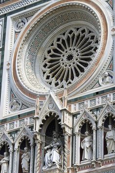 an ornate cathedral with statues on the outside