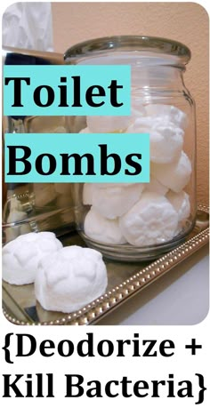 a jar filled with white cotton balls sitting on top of a table