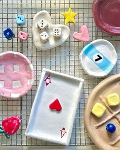 some clay toys are sitting on a wire rack