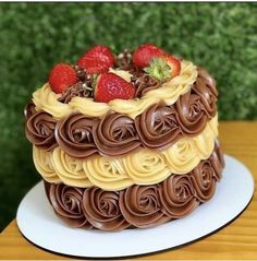 a cake with chocolate icing and strawberries on top