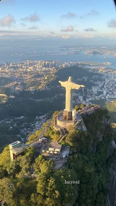 an aerial view of the statue of christ on top of a mountain in rio, brazil