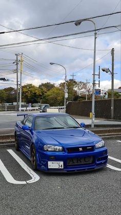 a blue car is parked in the parking lot