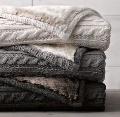 several blankets stacked on top of each other