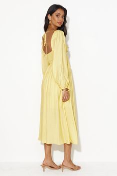 Length from shoulder to hem of size S: 118cm. 
 Chest 37cm, Waist 30cm, size S.  
 Midi dress. 
 Semi-lined. 
 Model is a standard XS and is wearing size XS. 
 True to size. 
 Non-stretch. 
 Elastic back. 
 Puff sleeves. 
 Flowy skirt. 
 Tie-up. 
 Zipper. 
 Cold hand wash only. 
 Polyester/Rayon/Spandex. 
 
 
 
 
 
 
 
 
 Feel your absolute best in the Dancing Deni Long Sleeve Midi Dress. Featuring an elastic back, puff sleeves and a flowy skirt. Style with sandals for a gorgeous day 'fit. Yellow Long Sleeve Dress, Dress Date Night, Yellow Midi Dress, Bridal Shower Dress, Long Bodycon Dress, Jumpsuits And Romper, Skirt Style, Dress Yellow, Long Sleeve Lace Dress