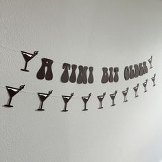 there is a banner that says happy new year and martini glasses on the line next to it