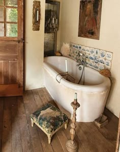 an old fashioned bathtub in a rustic bathroom