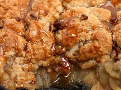 a close up of food in a pan with sauce and toppings on the top