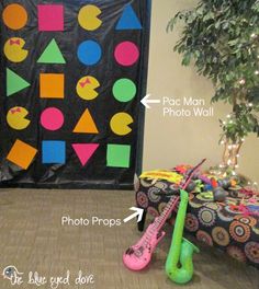 a bulletin board with different shapes and sizes in front of a christmas tree on the floor