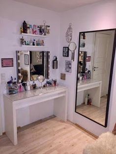 there is a vanity and mirror in the room