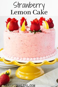 a strawberry lemon cake with fresh strawberries on top