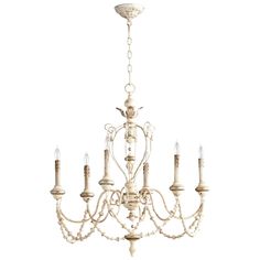 a white chandelier with five candles hanging from it's center and four arms