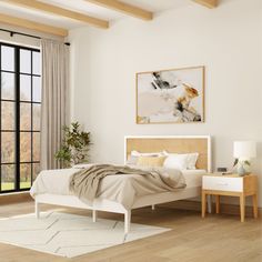 a bedroom with white walls and wood flooring has a large window overlooking the yard