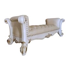 a white bench with ornate carvings on the back and arms, sitting against a white background