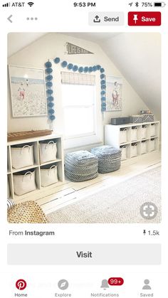 an attic bedroom with white storage units and blue decorations on the walls, along with baskets