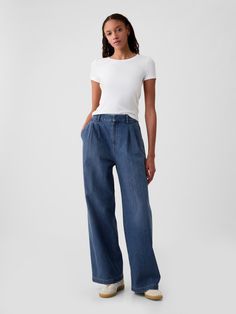 Soft structured denim trousers.  E-waist with concealed hook and bar closure, zip fly.  Front slant pockets, back welt pockets.  Pleating at front.  Responsibly Made: This denim trousers is part of our water-saving Washwell program.  Compared with conventional wash methods, Washwell uses at least 20% less water and has saved over a billion liters of water since 2016.  Responsibly Made: Made with 6% recycled cotton.  Using recycled materials helps to conserve resources and reduce waste.  * Fit: Classic.  An easy silhouette that fits close  at the waist, and is relaxed through the hips and thigh.  Models wearing Gap High Waisted Wide Leg Jeans, Azul Indigo, Polka Dot Blouse, High Rise Denim, Denim Trousers, Fashion Studio, Wide Leg Denim, Trouser Jeans, Spring Summer Outfits