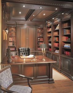 a large wooden desk sitting in front of a bookshelf