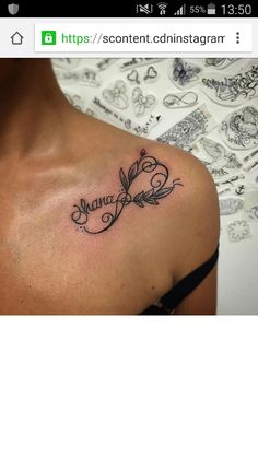 the back of a woman's shoulder with a name tattoo on it