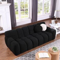 a large black couch in a living room