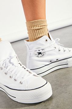 The high-top Converse sneakers you know and love with a lifted upgrade, featuring a chunky platform sole, while staying true to the brand’s iconic style. * Lace-up closures * Cushioned insole * Slim-fitting style | Chuck Taylor All Star Lift Hi-Top Sneaker by Converse at Free People in White, Size: US 8 Tenis Aesthetic, Shoes Sneakers High Tops, 80s Prom, Chuck Taylor All Star Lift, Shopping Shoes, Xmas 2024, Basic Shoes, Shoes Ideas, Cute Sneakers