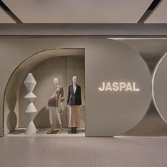 a display case with mannequins in it and the words jaspal