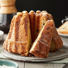 there is a cake that has been cut in half on the plate and ready to be eaten