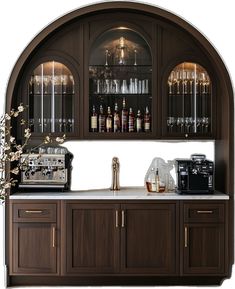 an arch - shaped bar with wine glasses and liquor bottles on the shelves, along with a coffee maker