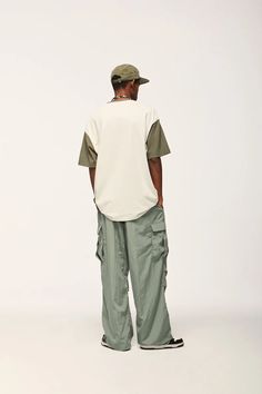 Elevate your streetwear with our Jet Cargo Pant. Vintage-inspired design, made from polyester and nylon, featuring midweight fabric and drawstring closure. SPECIFICATIONS Material: Polyester, Nylon Thickness: Midweight Waist Type: Mid Decoration: Pockets Closure Type: Drawstring Fabric Type: Broadcloth Green Nylon Parachute Pants Athleisure, Green Nylon Parachute Pants For Athleisure, Green Nylon Parachute Pants With Relaxed Fit, Casual Green Nylon Pants, Green Nylon Cargo Pants, Athleisure Style, Urban Style Drawstring Sweatpants For Streetwear, Green Nylon Cargo Pants In Athleisure Style, Green Parachute Pants With Elastic Waistband For Streetwear, Green Nylon Cargo Pants For Athleisure