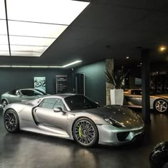 a silver sports car parked in a garage