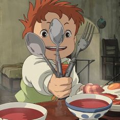 a young boy sitting at a table with two bowls and spoons in front of him