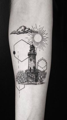 a black and white photo of a lighthouse tattoo on the right arm with geometric shapes around it