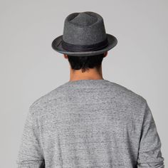 This premium Faux Felt Pork Pie Fedora offers superior style with a 1.75" brim, grosgrain printed band, and knotted faux leather cording. Its timeless silhouette lends a sophisticated look that never goes out of fashion. Features: Color: BlackMaterials: 100% PolyesterSize: 59cmBrim Size: 1.75" Classic Gray Hats For Spring, Classic Gray Hat For Spring, Classic Fitted Gray Fedora, Classic Gray Fedora, Classic Gray Spring Hat, Classic Wool Fedora For Spring, Fitted Wool Fedora For Spring, Spring Leather Fedora With Short Brim, Casual Leather Hats For Spring