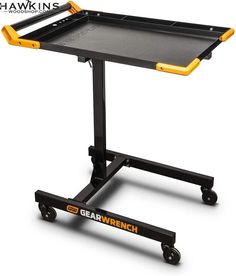 a black and yellow table on wheels with the word gerwench underneath it