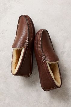 Sleek, sophisticated, and built for plush comfort, the Colt leather moccasins offer timeless style for luxurious lounging. These handsome slippers are crafted from embossed full-grain leather, with 100% genuine Australian Merino sheepskin lining for insulation, breathability, and cloudlike softness. Hand whipstitching along the vamp and heel offer a distinguished finish. Includes a two-layer EVA foam midsole and wedge heel for comfort and durability. Moccasin Slippers, Wool Coats, Sheepskin Slippers, Moccasins Slippers, Leather Moccasins, Leather Slippers, Eva Foam, Full Grain Leather, Wedge Heels