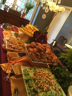 a buffet table filled with different types of food