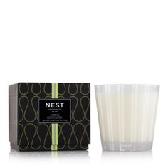 the nest candle in front of a box