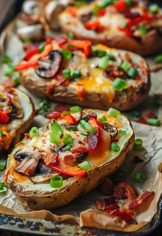 baked stuffed mushrooms with peppers and green onions on a baking sheet, ready to be eaten