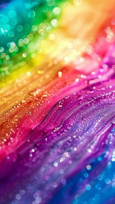 an abstract rainbow background with lots of water droplets