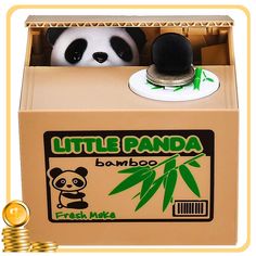 a panda bear sitting in a cardboard box next to stacks of coins and a coin bank