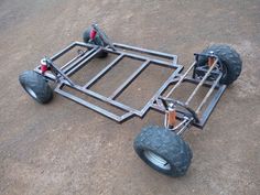 an off road vehicle with four wheels on the ground